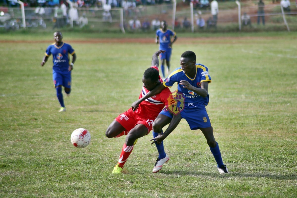 KCCA's lone goal scorer Derrick Nsibambi right battles for the ball in the vital affair