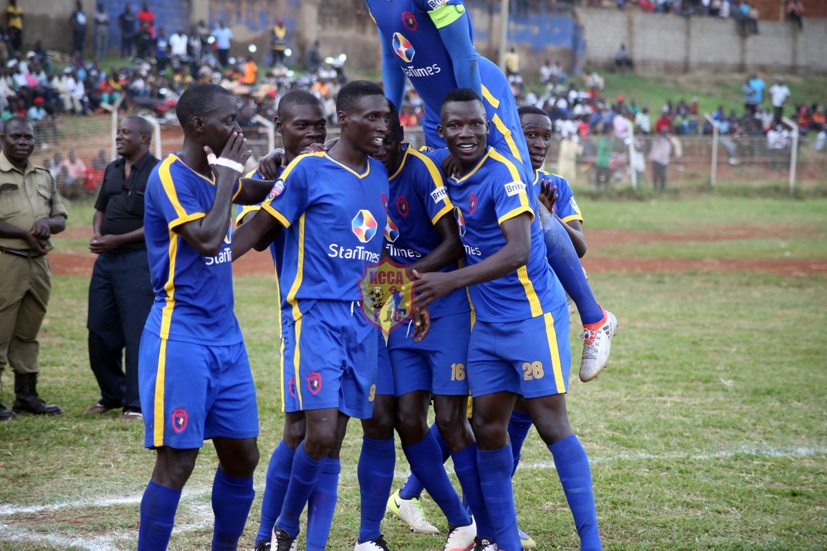 KCCA players congratulate goalscorer Derrick Nsibambi