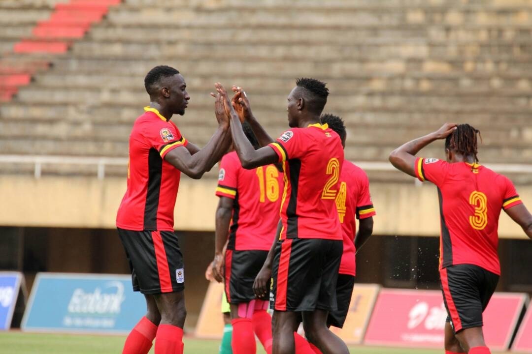 Ochaya right celebrates his goal with English based Cranes defender Bevis
