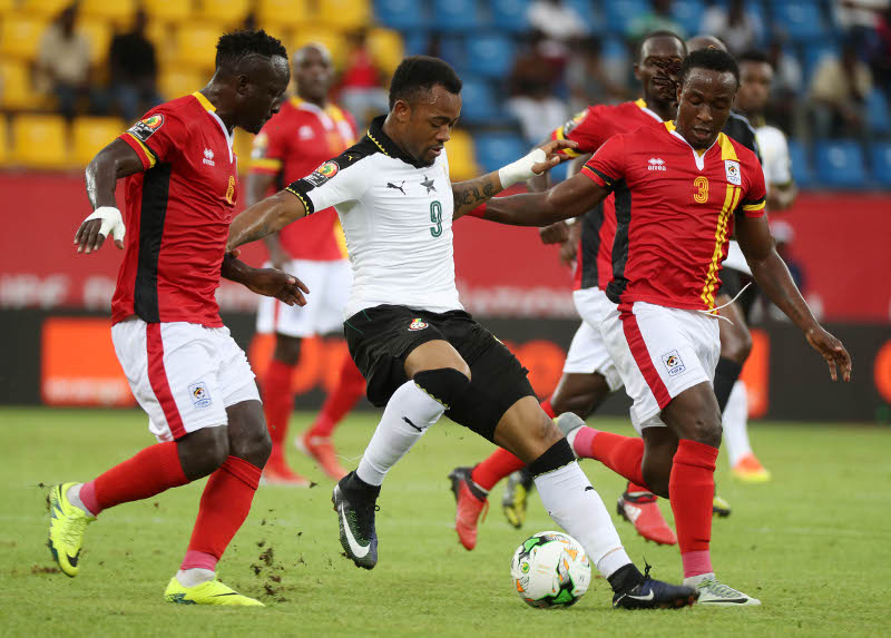 Tonny Mawejje and Baba kizito battling Ghana striker, Jordan Ayew