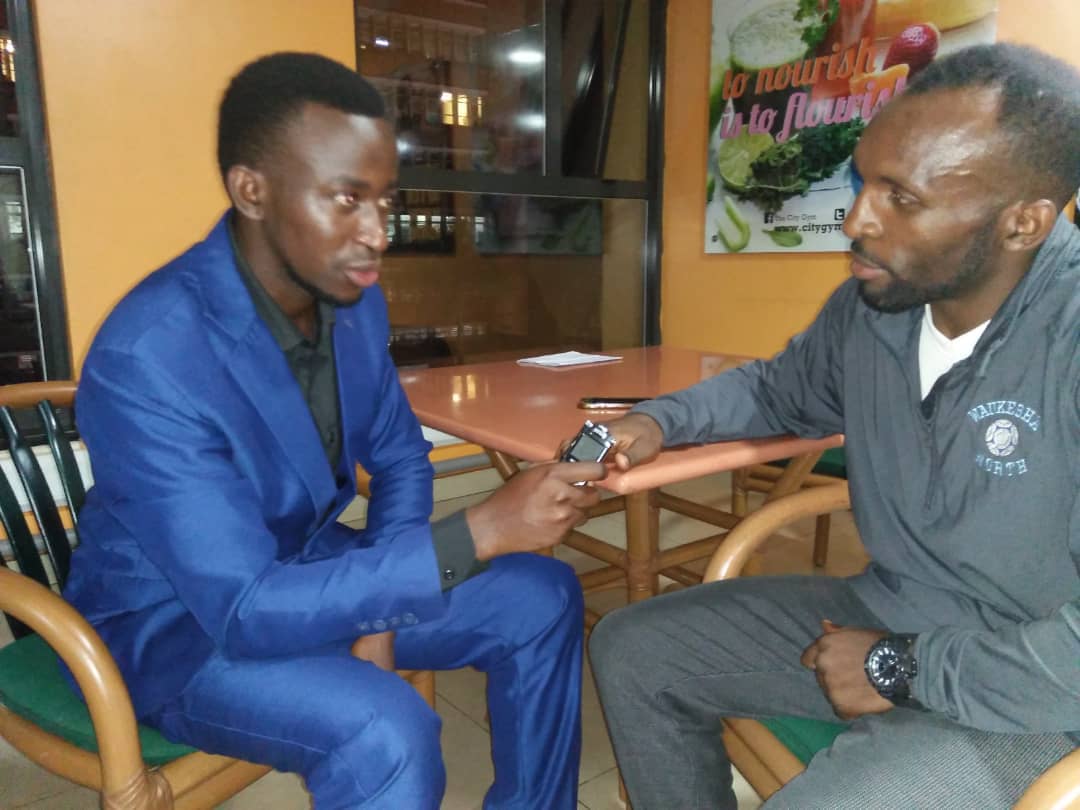 Huzaifa Ssenkima (L) interviewing Alex Matsiko at City Gym