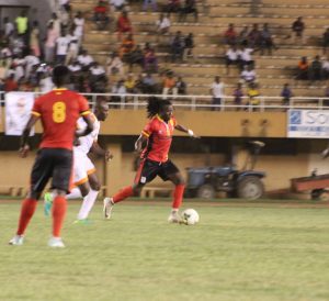 Allan Katerega taking on Niger player in last night's 2-1 defeat